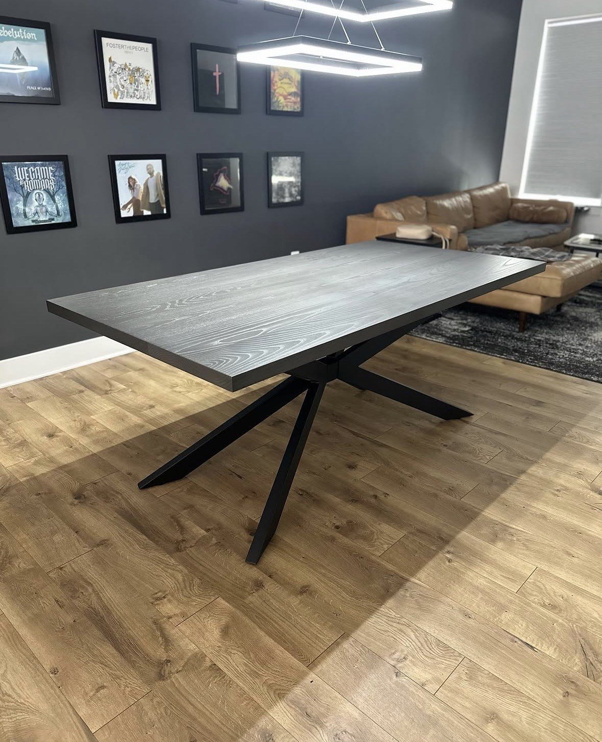Modern gray dining table with angular metal base